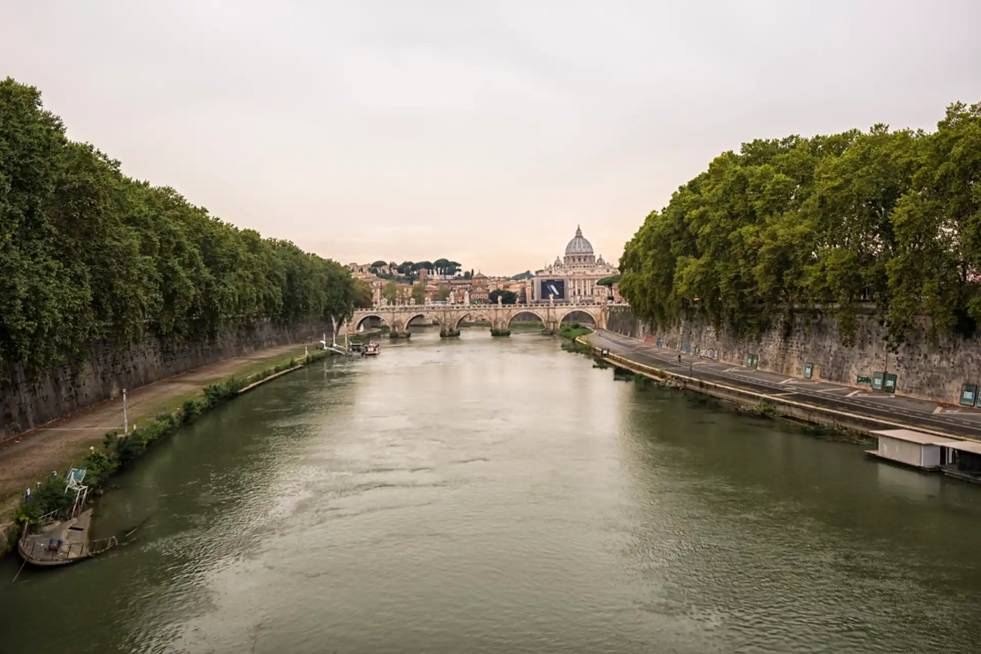 The Tiber river in Rome with St Peter’s dome in the distance