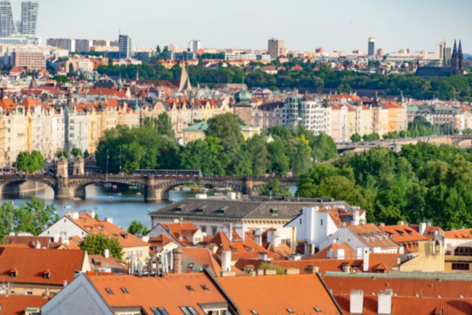 Red rooftops of Prague and bridges over the Vltava river